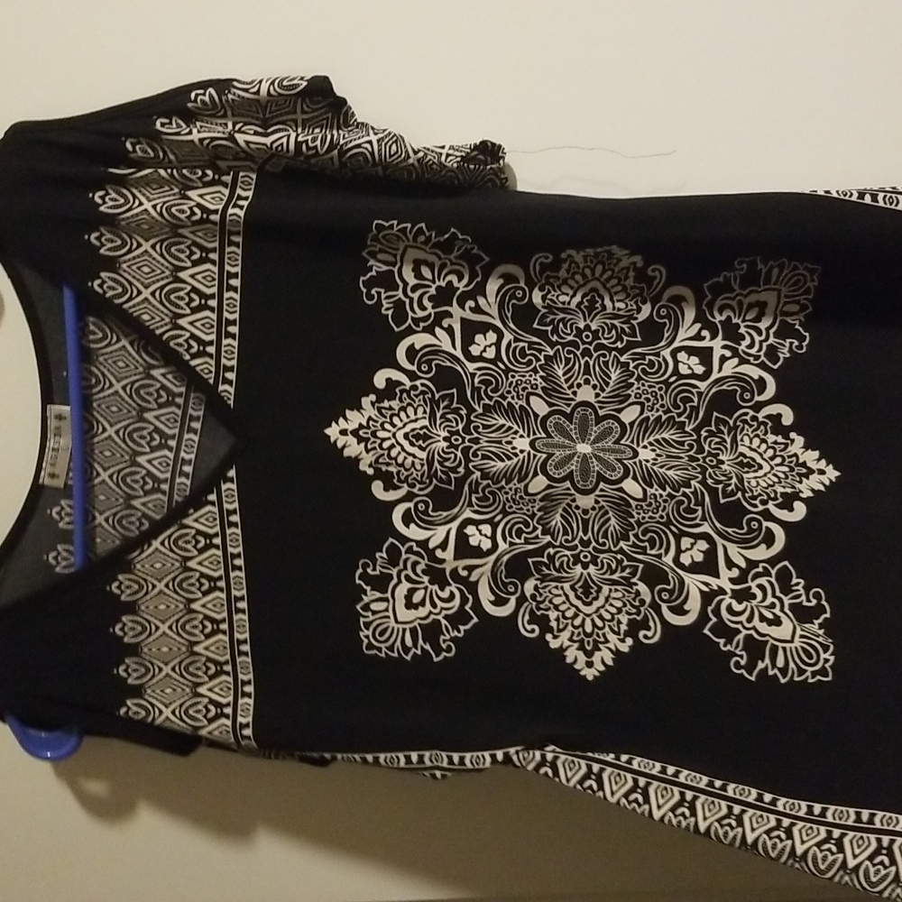 Black and tan designed open shoulder blouse. size Large.